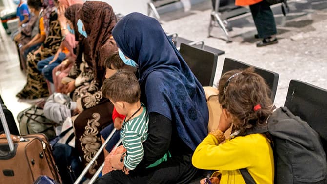 Amnesty International criticises the UK's falling asylum approval rate for Afghan women, Creator: Reuters